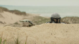 (L-R) Grogu and Mandalorian (Pedro Pascal) in Lucasfilm's THE MANDALORIAN AND GROGU. Photo courtesy of Lucasfilm. � 2025 Lucasfilm Ltd�. All Rights Reserved.